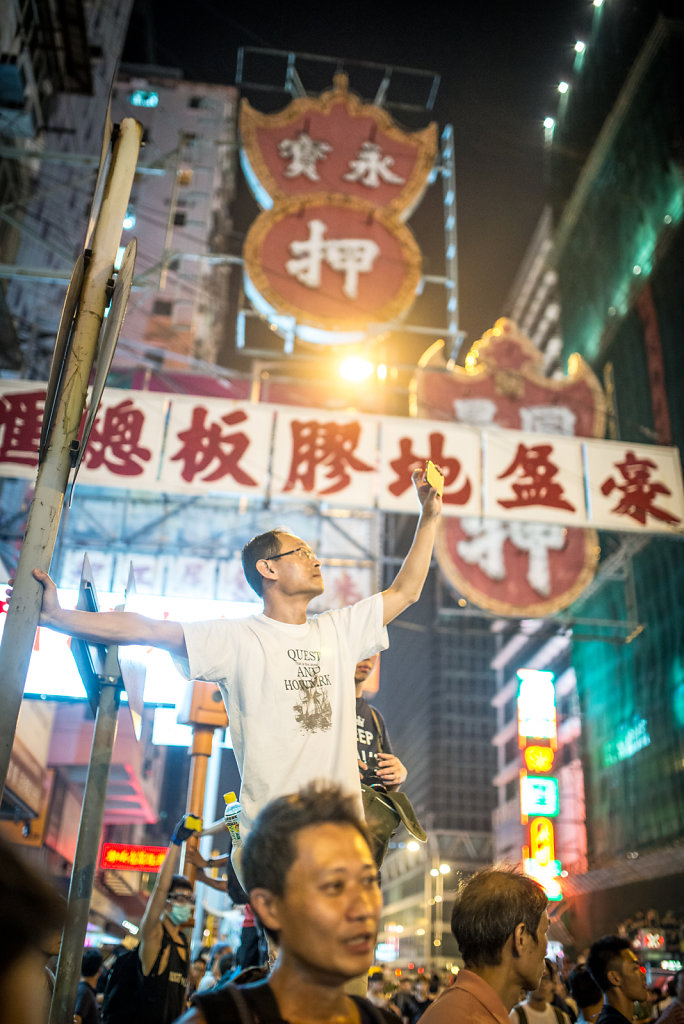 A protester taking a phone pic of the crowd