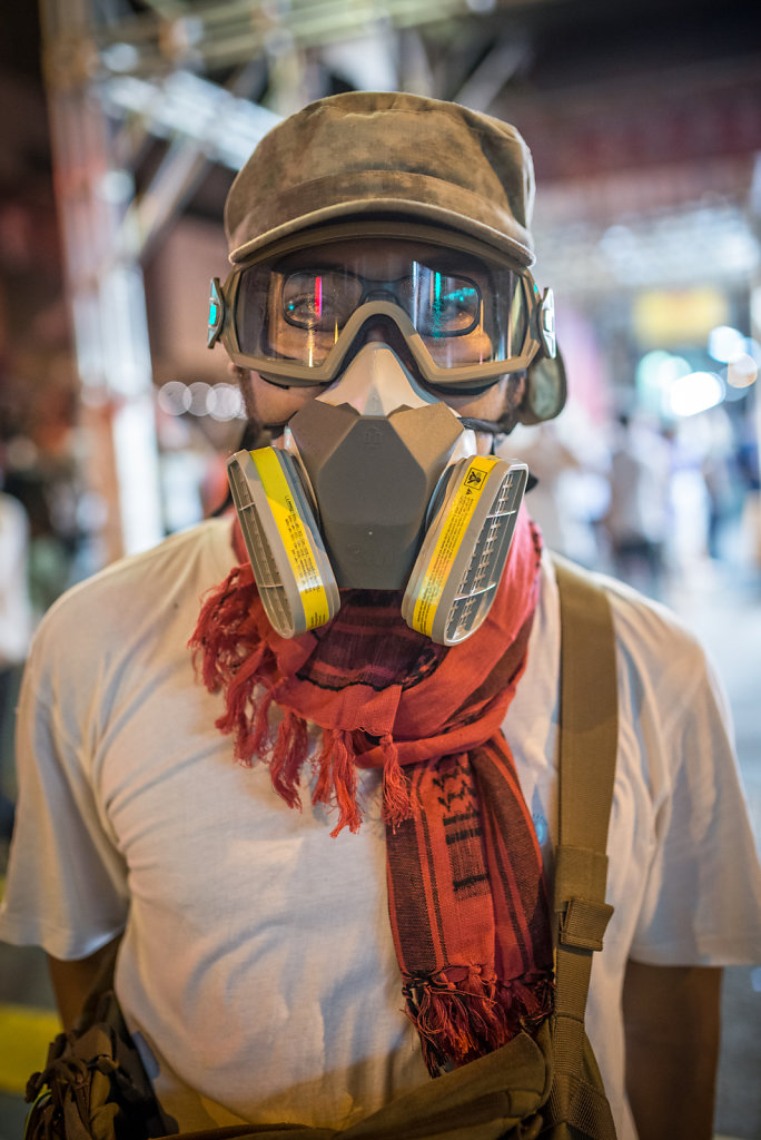 Protester wearing a gasmask