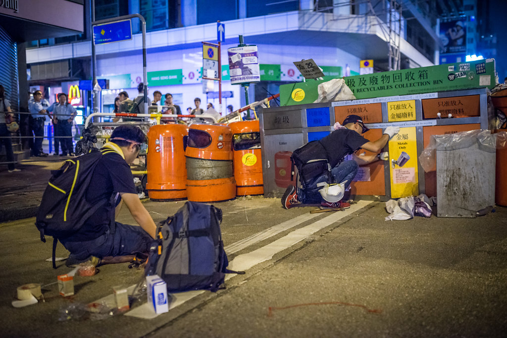 Protesters putting the final touches to their barricade