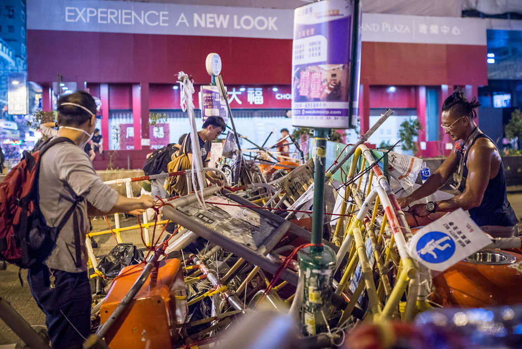 Protesters setting up a barricade