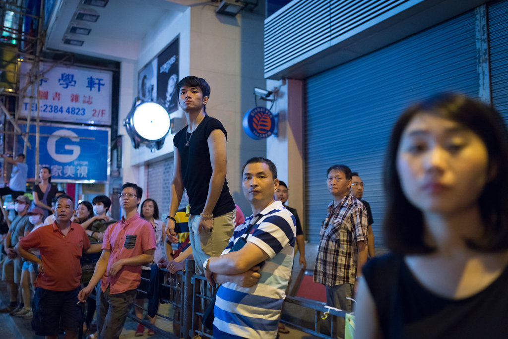 Crowd stares at an argument at Occupy Central