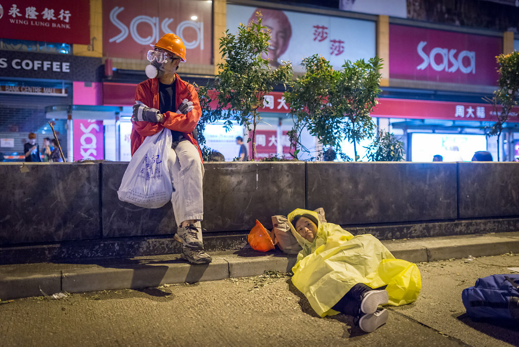 A couple ready to spend the night in an occupied street